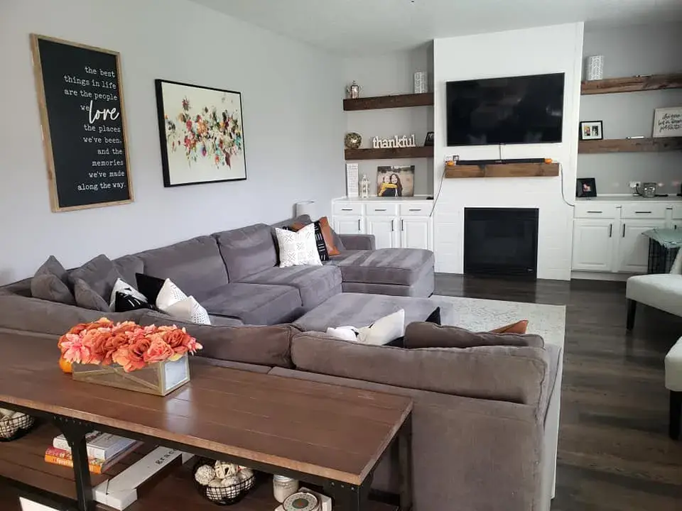 Modern living room with gray sectional sofa.