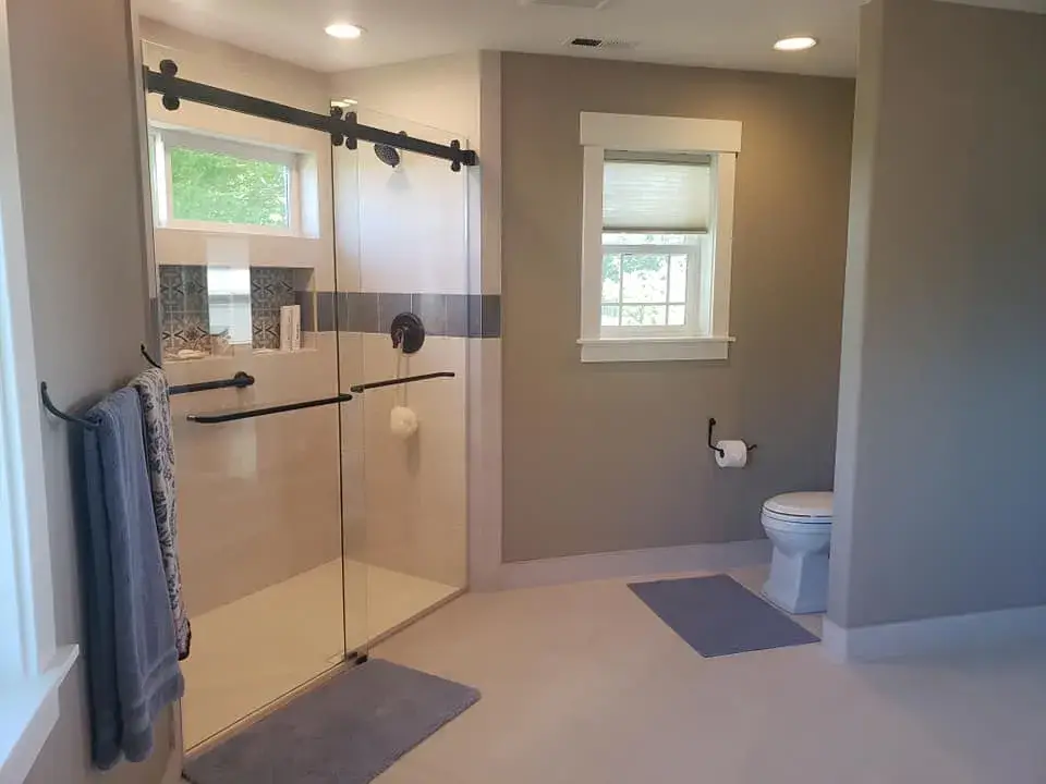 Modern bathroom with glass shower and natural lighting